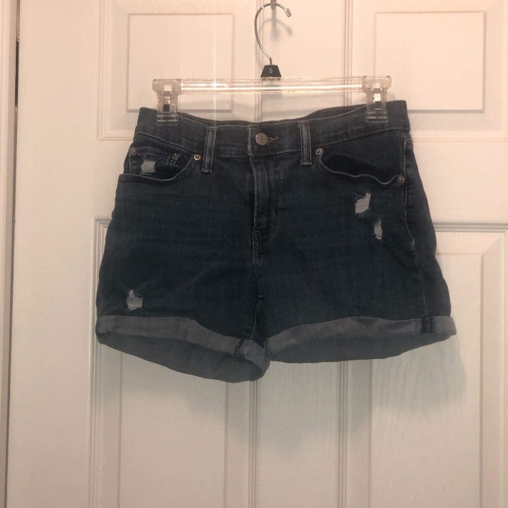 Mid length Levi’s slightly distressed jean shorts